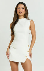 Langley Mini Dress Sleeveless High Neck Faux Wrap Tulip Dress in Cream